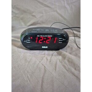 RCA RC205 digital AM/FM alarm clock radio in black with a red LED display